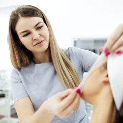 Face procedure lifting PDO Suture operation, face lifting surgery. Innovative technique of thread lift, cropped cosmetologist preparing to do procedure, select the appropriate thread option