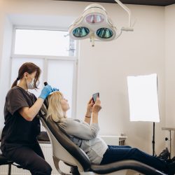 Mesotherapy, hair treatment. Mature woman with hair loss problem receiving treatment in clinic, Cosmetics for strengthening and hair growth